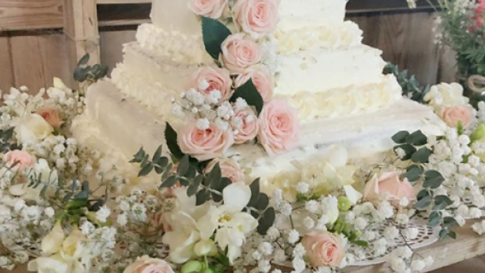 Couple creates DIY wedding ceremony cake from Costco sheet desserts and Trader Joe’s flowers